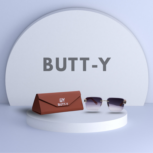 Sunglasses with a brown case on a white platform with 'BUTT-Y' branding.