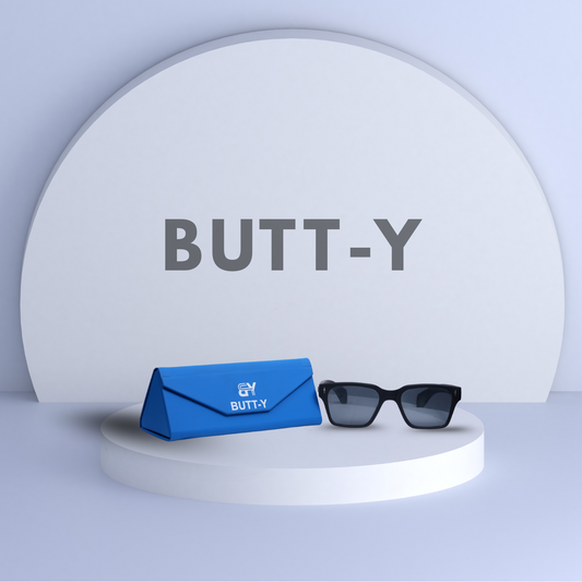 Sunglasses and blue case with 'BUTT-Y' branding on a white platform.