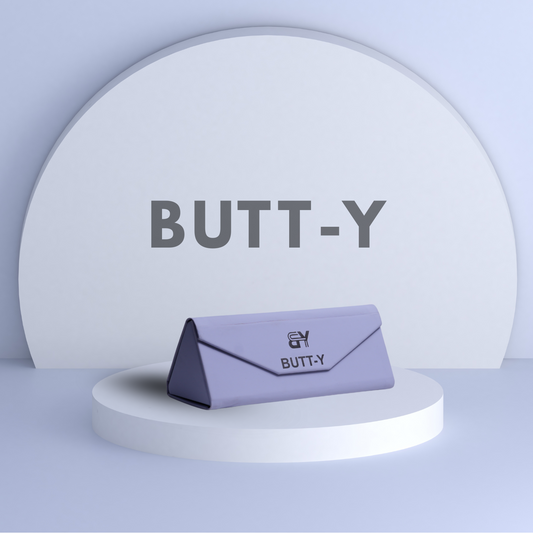 Purple product with 'BUTT-Y' branding on a white platform against a light gray background