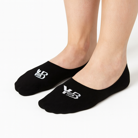 Black socks with white logo worn by a person on a white background