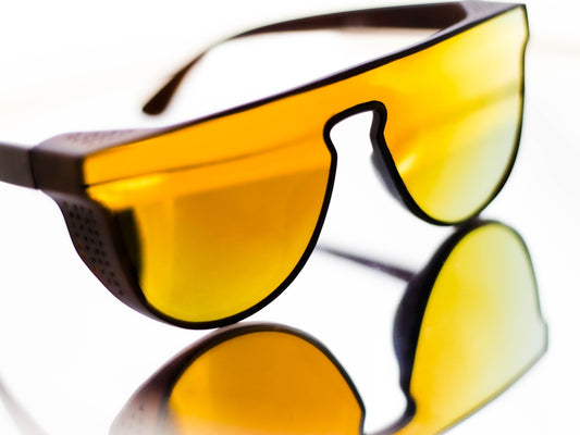 black framed sunglasses on white surface