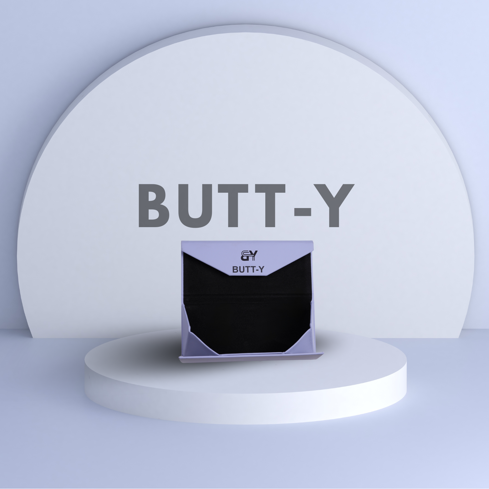 Product packaging with 'BUTT-Y' branding on a white platform against a light gray background