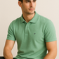 Effortless Style. Everyday Comfort. – BUTT-Y® Men’s Pista Green Polo T-Shirt with Signature Logo