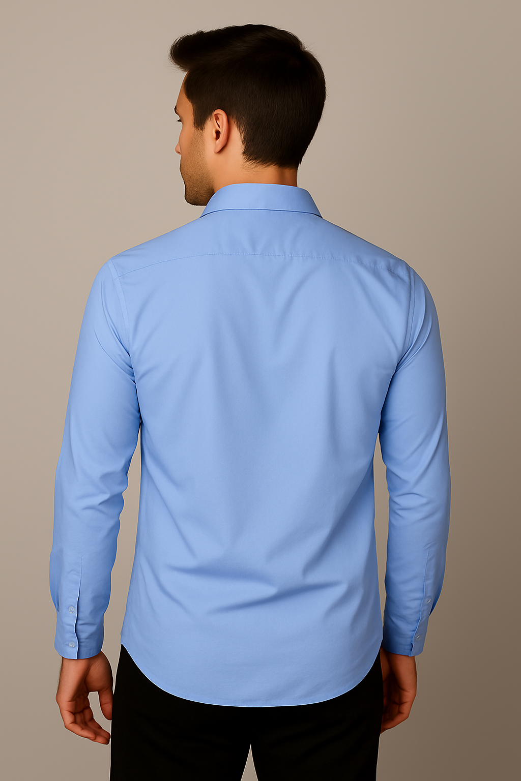 Man wearing a light blue dress shirt against a beige background