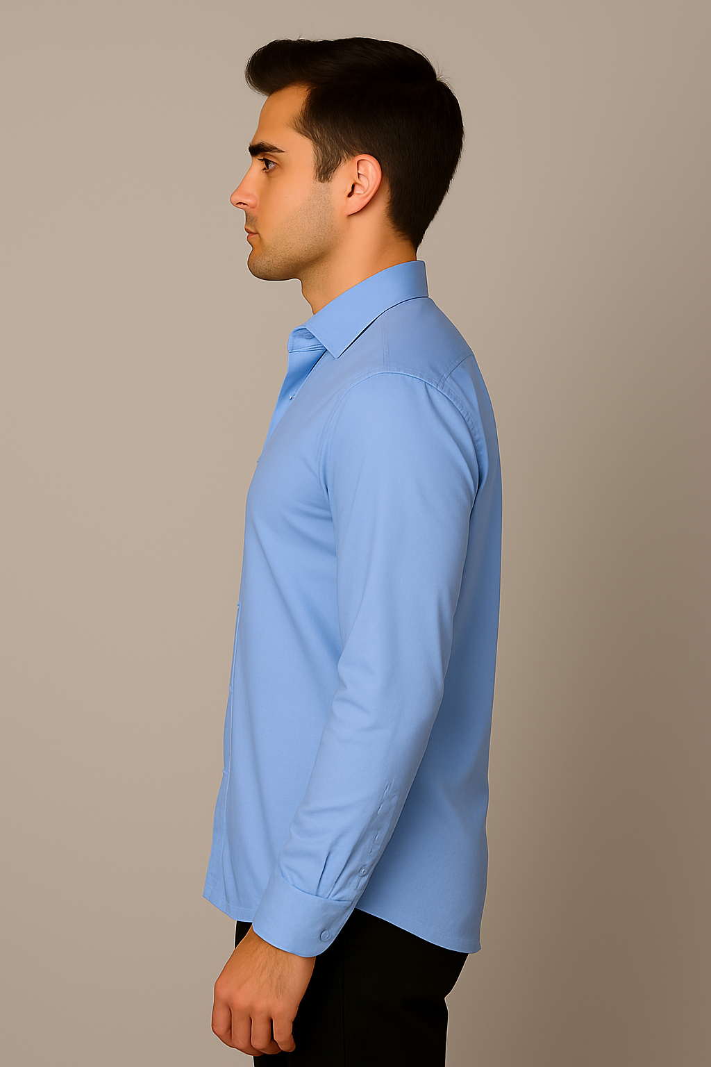 Man wearing a light blue dress shirt against a beige background