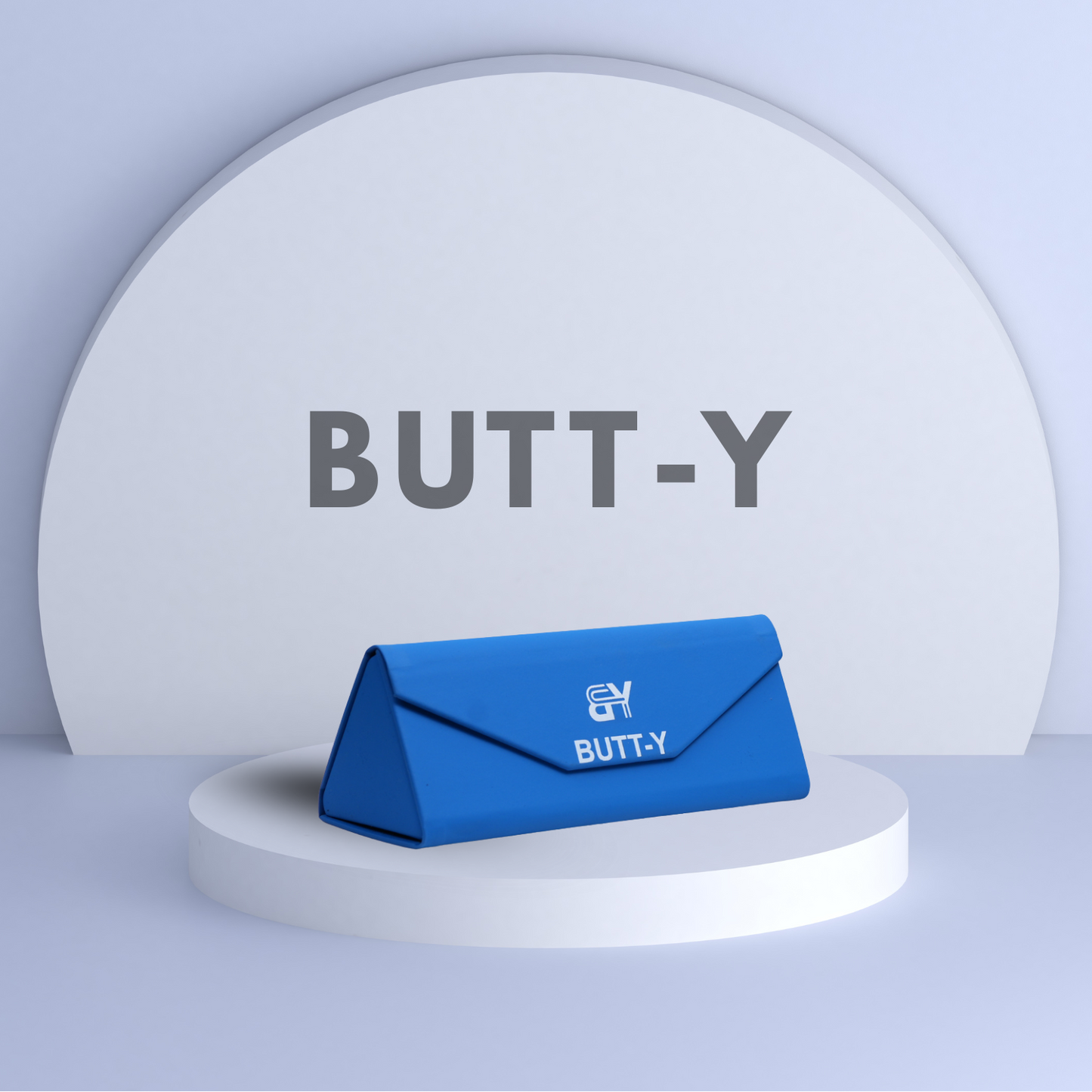 Blue product packaging with 'BUTT-Y' branding on a white platform against a light gray background.