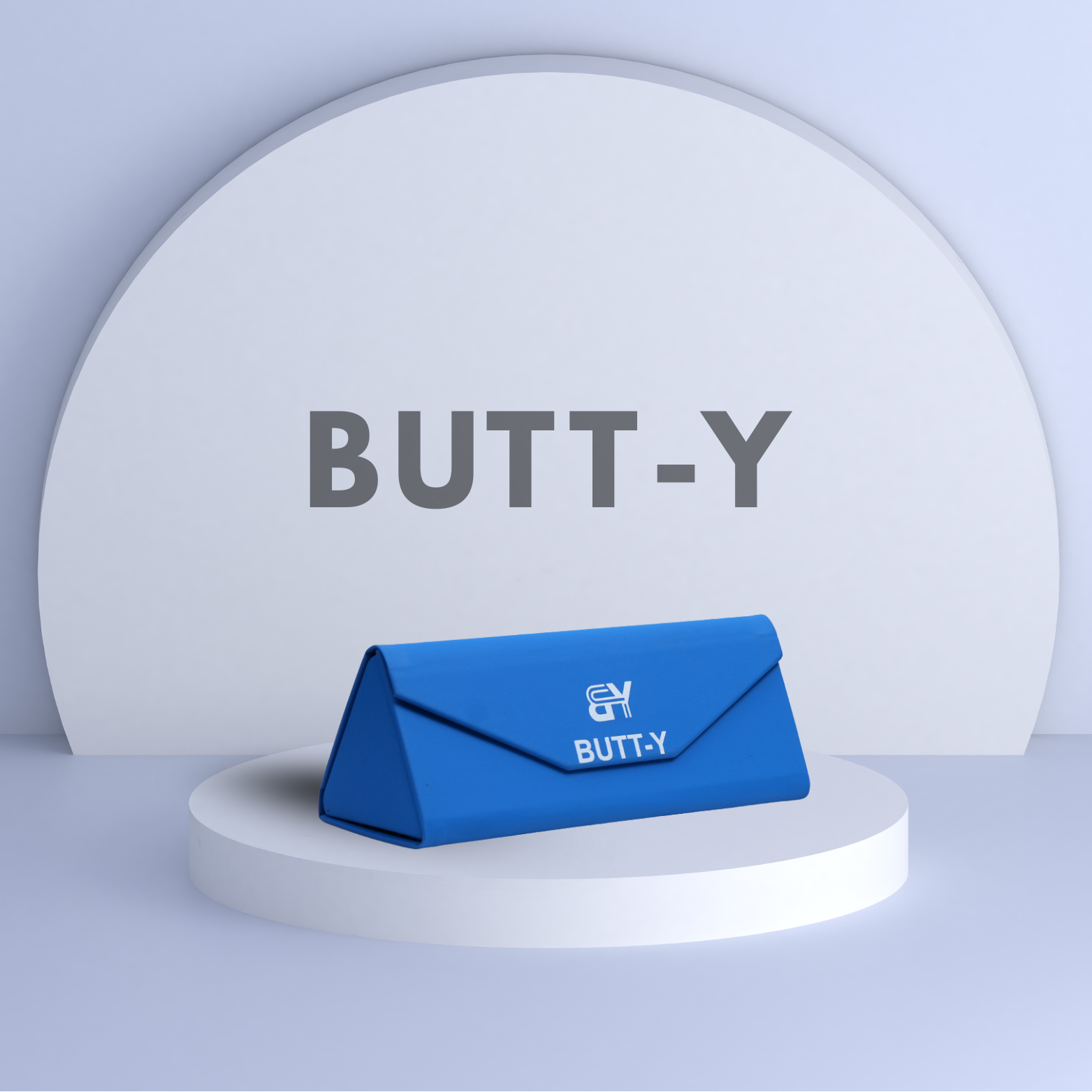 Blue product packaging with 'BUTT-Y' branding on a white platform against a light gray background.