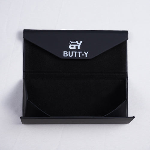 Black product packaging with 'GY' logo and 'BUTT-Y' text on a white background
