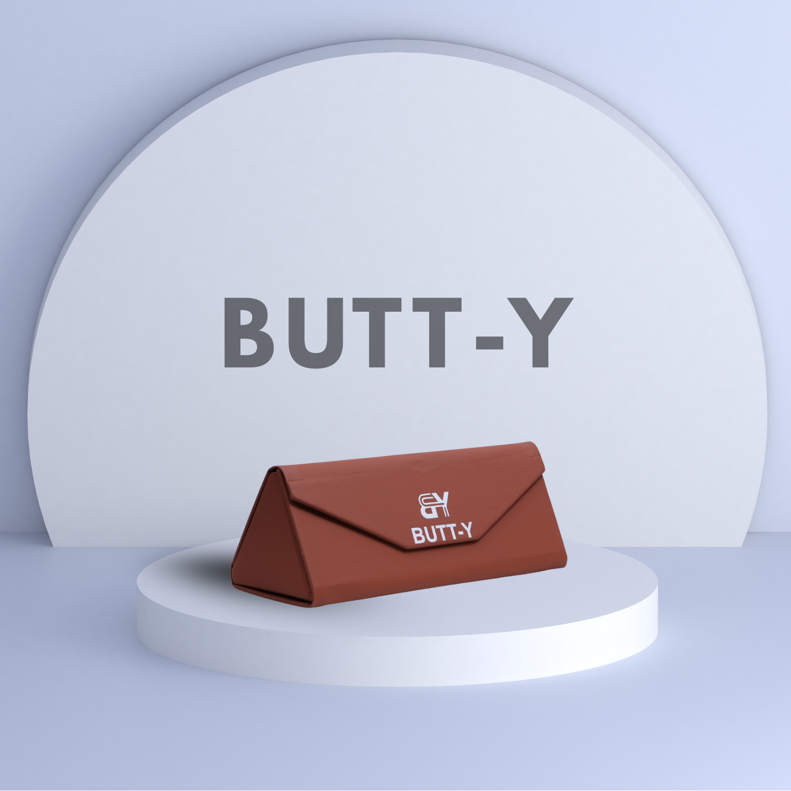 Brown pouch with 'BUTT-Y' branding on a white platform against a light gray background