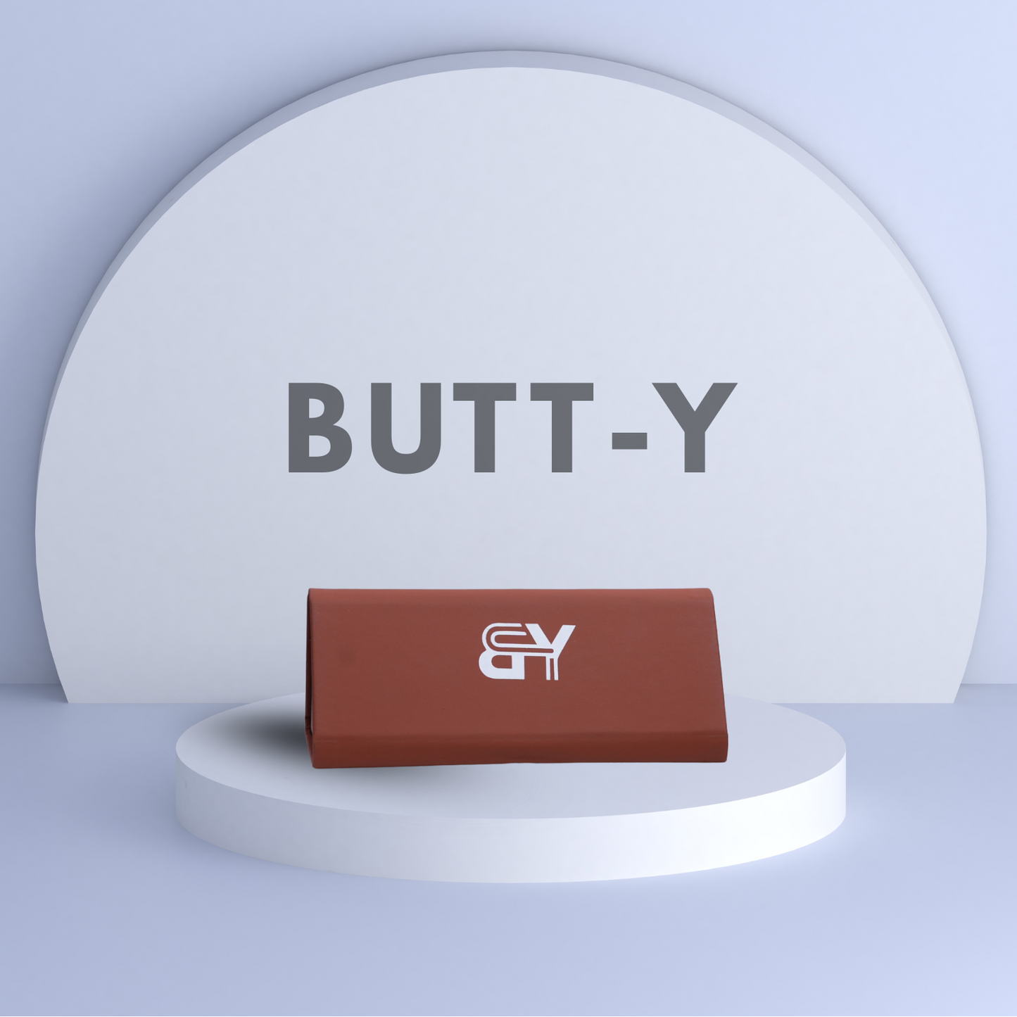 Brown wallet with a logo on a white platform against a light blue background with 'BUTT-Y' text.