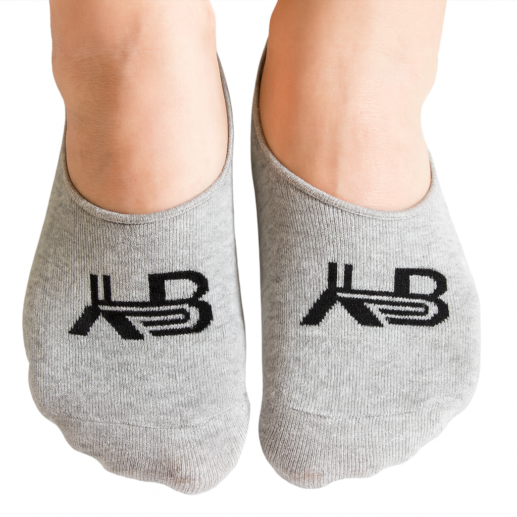Gray socks with a logo on the toes against a white background