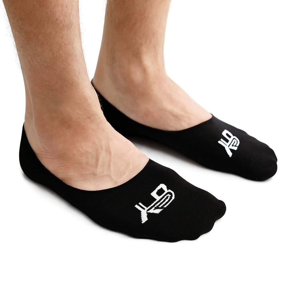 Black socks with white logo worn by a person on a white background