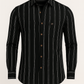 Black striped shirt with buttons on a beige background