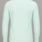 Light green shirt on a gray background