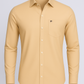 Beige shirt with a logo on a light gray background