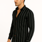 Man wearing a black striped shirt on a white background