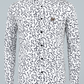 White shirt with black abstract pattern on a light gray background