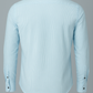 Light blue dress shirt on a gray background